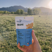 Hand holding Brami lupini beans snack Sea Salt & Vinegar Single-Serve