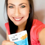 Woman holding Brami lupini beans pouch