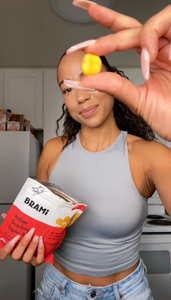 Woman reviewing Brami lupini bean snacks