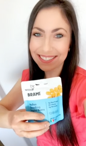 Woman reviewing Brami lupini bean snacks